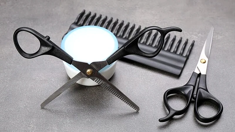 Barber set with tools and cosmetic on grey background