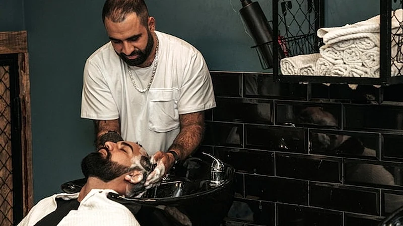 Hairdresser serving a client in a barbershop