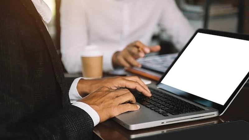 Screen computer mockup for advertising text Male hand using laptop texting contact business search information on desk in marketing office and design